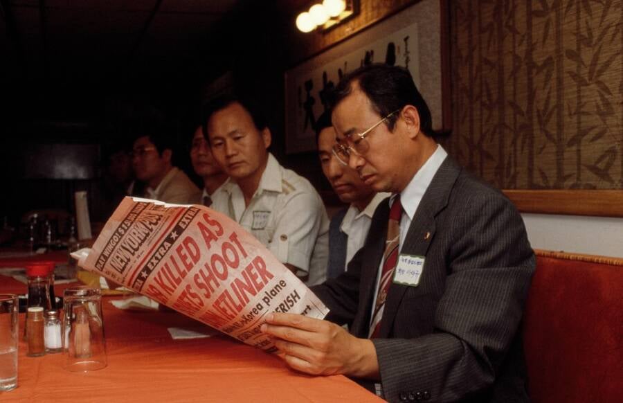 Korean Man Reading The New York Post