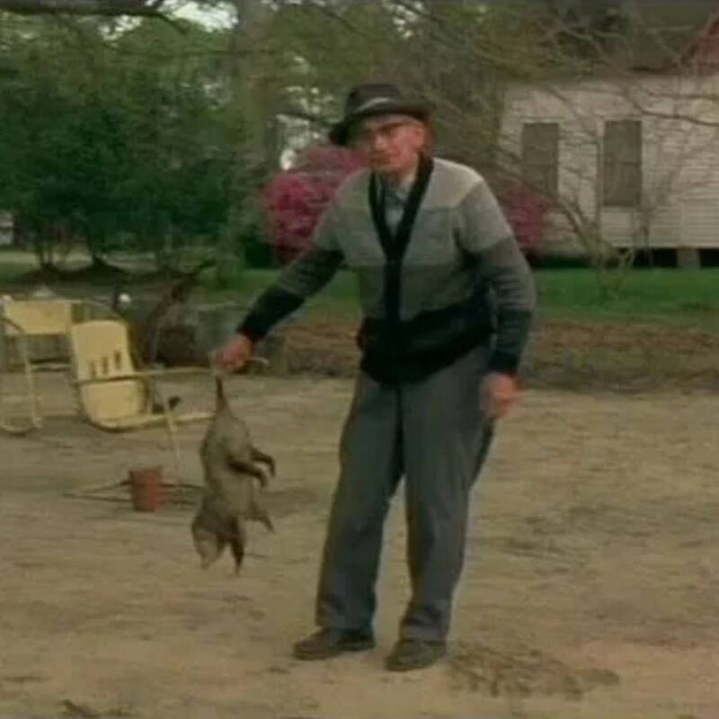 Man Holding A Possum In Nub City