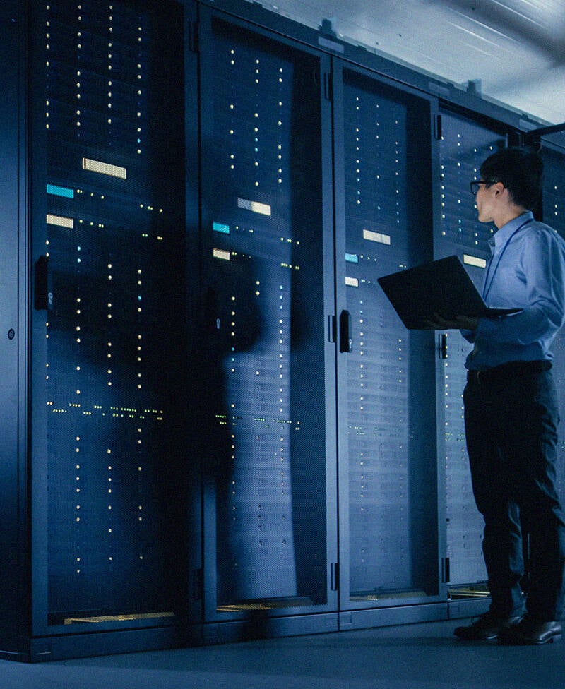 Technician Running Maintenance On Super Computer