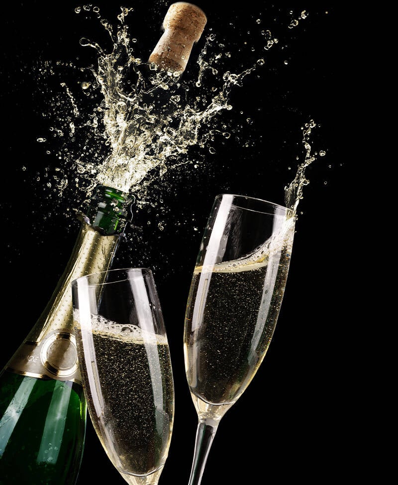 Popping Champagne And Toast Of Midnight