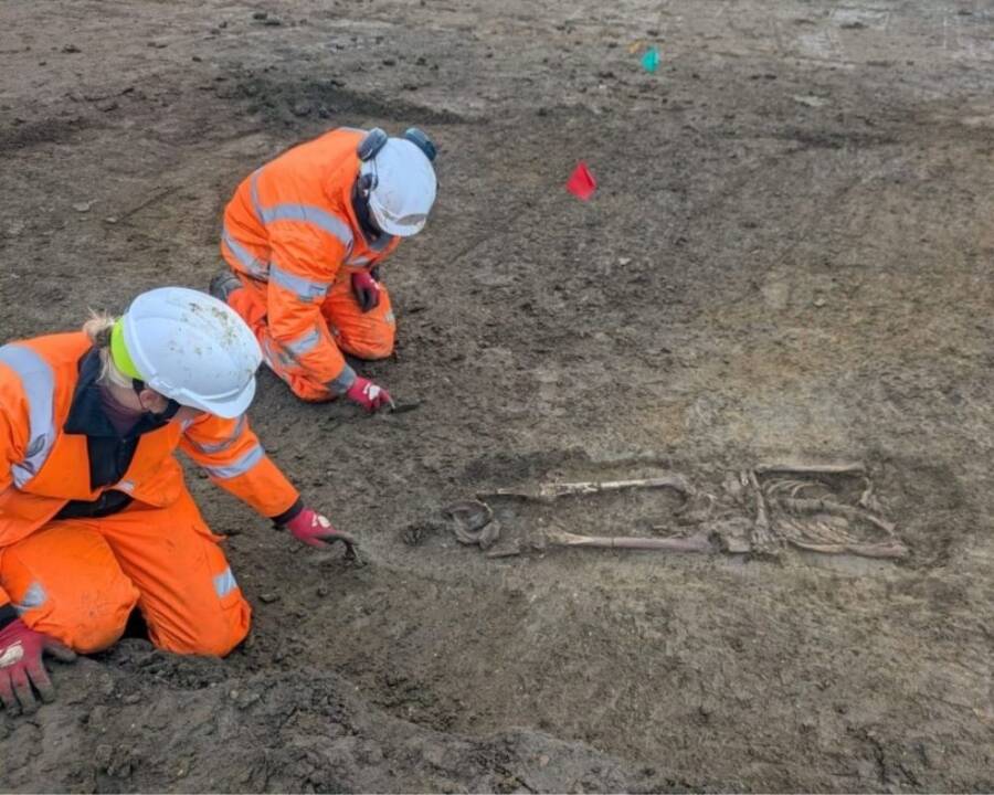 Skeleton With Skull Between Its Knees