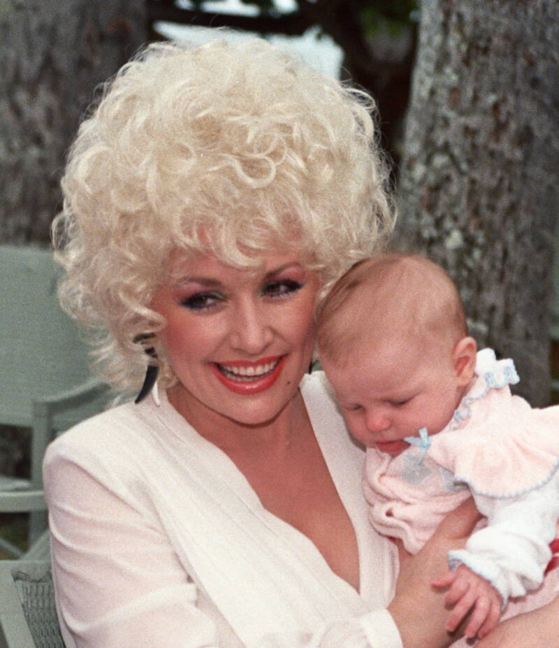 Dolly Parton Holding A Baby